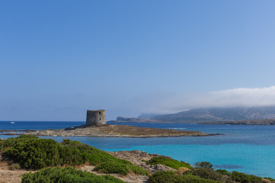 Caletta della Torre beautiful view of ruined tower on la pelosa beach sardinia italy