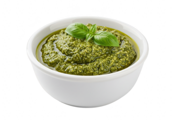 A bowl of fresh green pesto sauce garnished with basil leaves, isolated on a transparent background