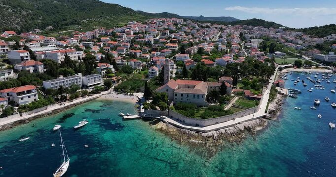 Port And Resort Town On The Croatian Island Of Hvar. Aerial Drone Shot