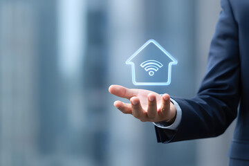 Hand Holding a Glowing House Icon with WiFi Symbol Inside