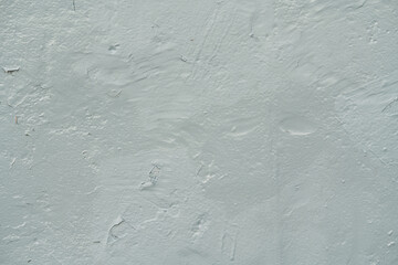 Close-up of the hull texture of an old warship. Abstract background with cracked gray-blue paint on the metal plating of a combat vessel.