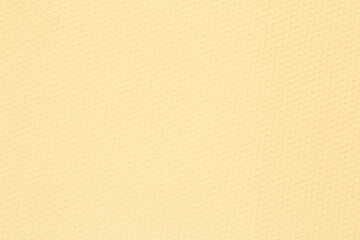close up of light yellow craft paper with honeycombs texture