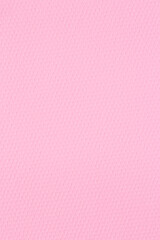 close up of pink craft paper with honeycombs texture