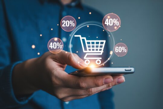 Hand holds phone, shopping cart icon with percentages displayed, suggesting online discounts and deals.