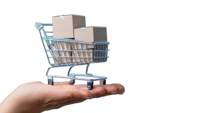 Miniature shopping cart filled with boxes held in a hand