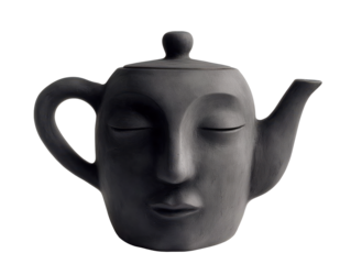 Black ceramic teapot shaped like a face with closed eyes on transparent background