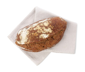 Loaf of rye bread and towel isolated on white, top view