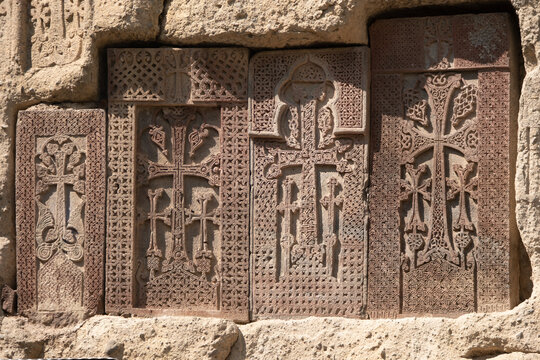 Wall of the ancient monastery made of volcanic stone Geghard, Armenia