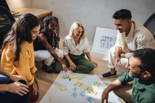 Professional architects collaborating on a project in a creative office workspace