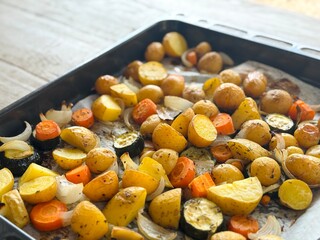 Roasted Vegetables Just Out of the Oven – Potatoes, Carrots, Zucchini, Onion and Garlic with...