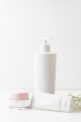White cosmetic bottle with pump for cream or gel, empty cosmetic tube, can be used for your own project, empty plastic tube