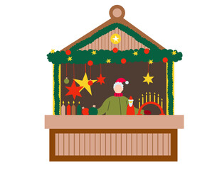Christmas market stall with vendor in Santa hat and festive decorations including stars, garland, candles, and ornaments.