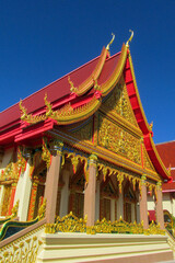 Fototapeta premium Thailand wat buddhist temples. Religious sacred places in Thailand, thai buddhism and classic stupa and pagoda architecture decoration with golden figures, flowers, colorful ornament and paintings