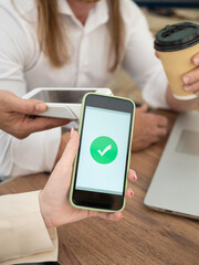 Business professionals using contactless payment technology