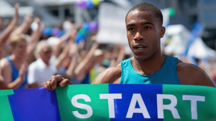 Runner at the Starting Line: A determined athlete stands ready, gripping the 'START' banner with unwavering focus, poised at the commencement of a thrilling race.