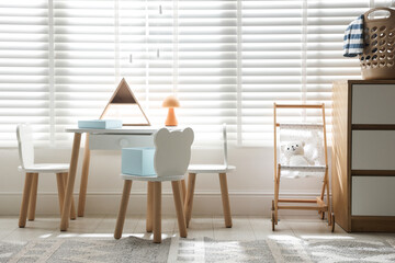 Stylish playroom with decor and furniture. Interior design