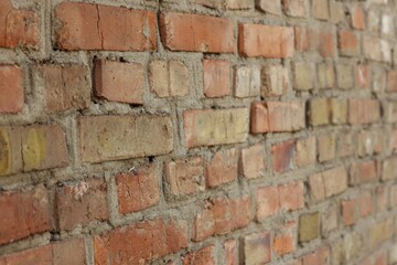 Naklejka premium Texture of old red brick wall as background, closeup