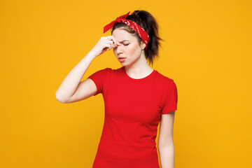 Young sad ill exhausted tired Caucasian woman she wearing red t-shirt casual clothes keep eyes...