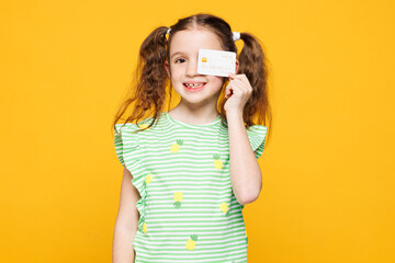 Little cheery fun cute kid child girl 8-9 years old wears green t-shirt hold cover eye with mock up...