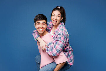 Young couple two friends family man woman they wear pink casual clothes together giving piggyback...