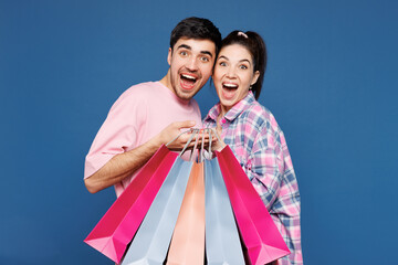 Young excited couple two friends family man woman they wear pink casual clothes together hold...