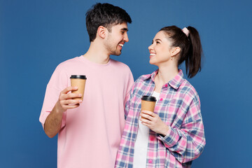 Young couple two friends family man woman they wears pink casual clothes together hold takeaway...
