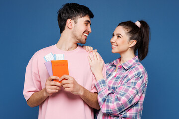Traveler couple two family man woman wear casual clothes hold passport ticket isolated on plain...