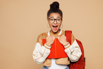 Young shocked surprised happy smart girl student wear casual clothes glasses backpack bag hold...