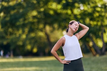 Woman Resting After Outdoor Exercise in Green Park Area