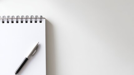 Blank Notebook and Pen on White Desk