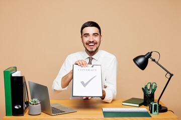 Young employee business man wear white shirt tie sit work at office desk with pc laptop show...