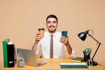 Young happy employee business man wears white shirt tie sit work at office desk with pc laptop...