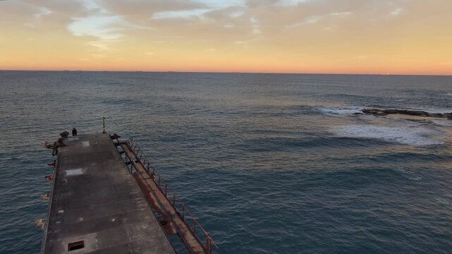 Pull back shot of a warf at Catherine Hill Bay