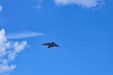 A plane flying in the vast sky.
