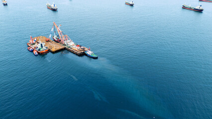 Oil leak from Ship , Oil spill pollution polluted water surface. water pollution as a result of human activities. industrial chemical contamination