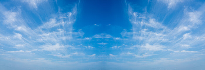 Clear blue sky with soft white clouds, perfect for backgrounds, nature themes, freedom, relaxation, and travel concepts, ideal for design and commercial use.