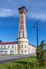Historic fire watchtower with observation deck in Rybinsk, Russia. Architectural monument and urban landmark.