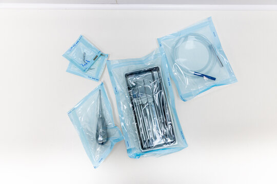 Surgical instruments packaged in sterile environment ready for medical procedures including various tools essential for healthcare and surgical operations. - Powered by Adobe