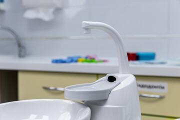 Modern White Dental Equipment in Clinic with Sink and Countertop, Featuring Aesthetic Design Elements for Effective Oral Care and Hygiene Practices