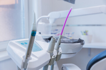 Modern Dental Tools and Equipment Highlighted in a Well-Lit Dental Office Environment with a Focus on Oral Healthcare Technologies and Patient Comfort