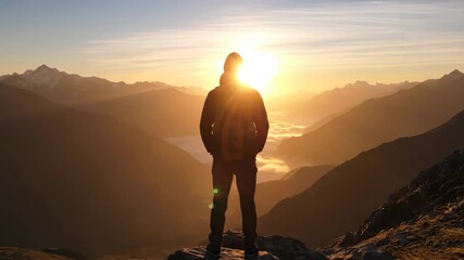 Hiker silhouette on mountain peak at sunrise scenic view landscape travel adventure photography - Powered by Adobe