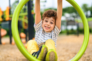 Happy kid on playground on summer season