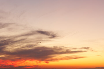 yellow orange sunset sky with clouds