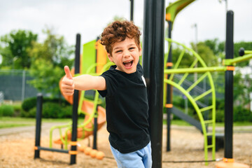 Fototapeta premium Happy kid on playground on summer season