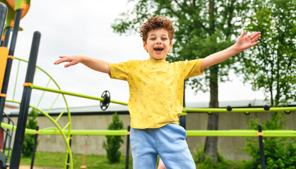 Happy kid on playground on summer season