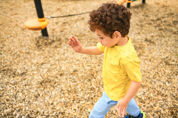 Happy kid on playground on summer season