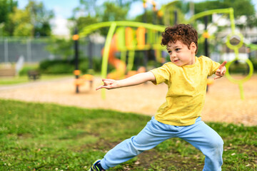 Happy kid on playground on summer season