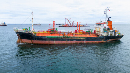 LPG tanker ship navigating calm blue waters near an offshore terminal. Ideal for themes on energy...