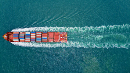 cargo ship carrying container and running for export goods from cargo yard port to custom ocean...
