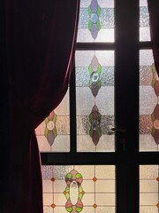 A Textured and Colorful Stained Glass Door, Filtering the Sunlight